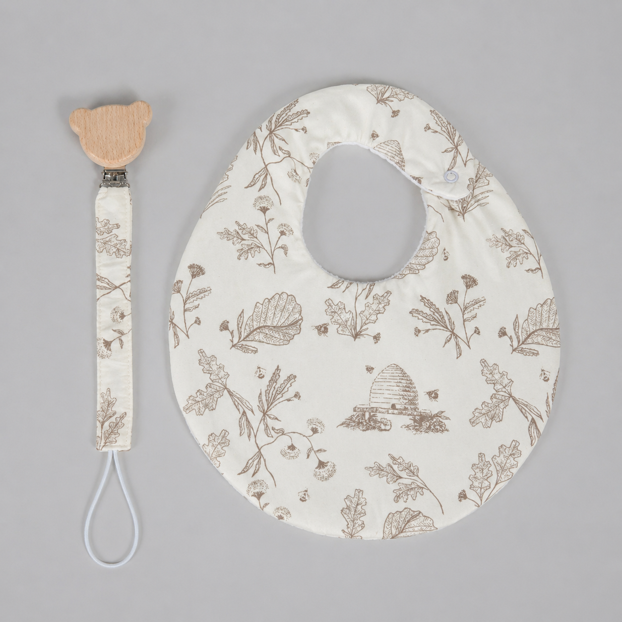 Set babero & portachupon abejas beige (impermeable)