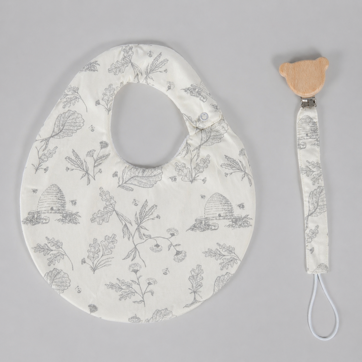 Set babero & portachupon abejas azul (impermeable)