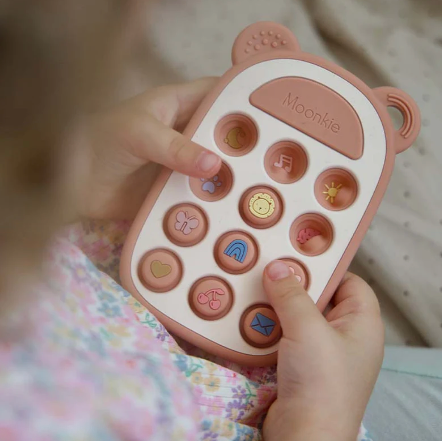 Juguete sensorial pop it telefono con portachupon